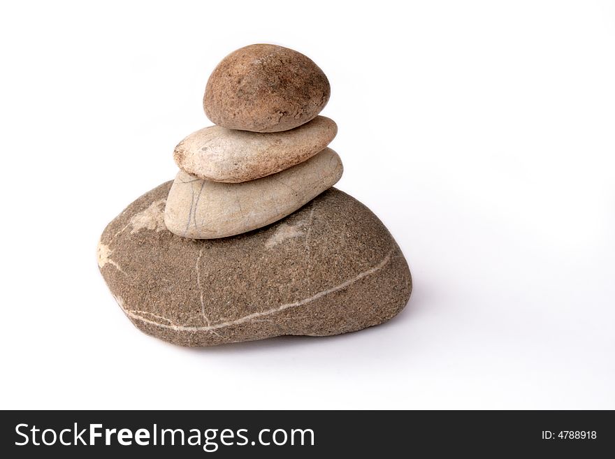A pyramid made of stones isolated on white background. A pyramid made of stones isolated on white background