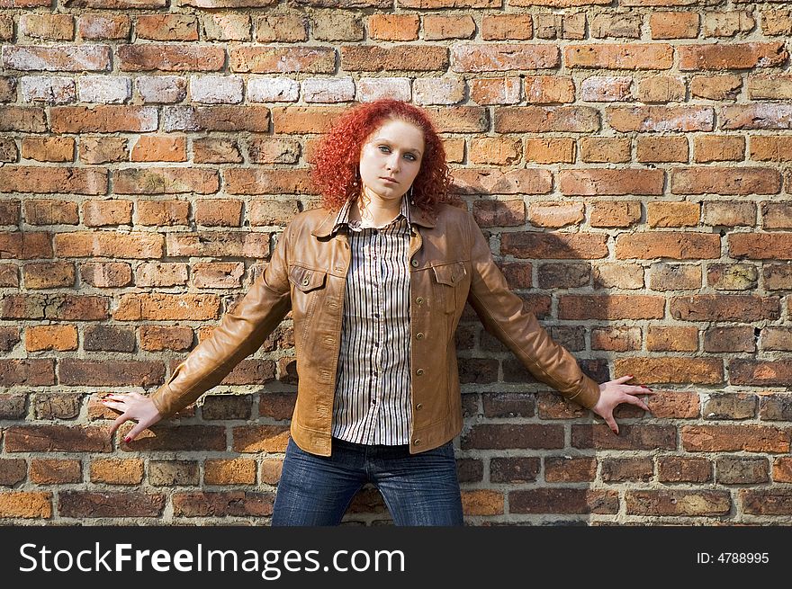 Beautiful young women over bricked wall