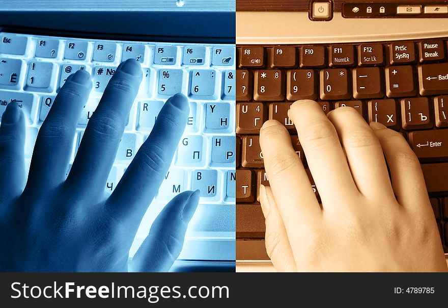 Human hands typing on the keyboard