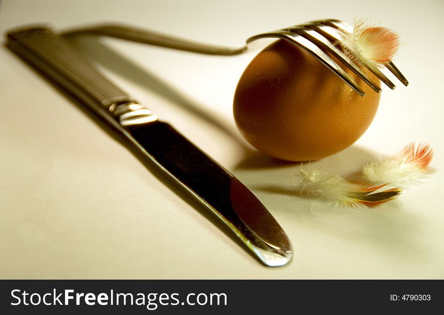 Egg with a fork and knife