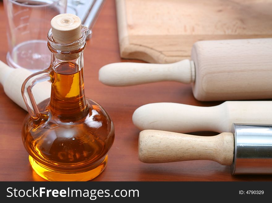 Vegetable oil and kitchen tools, background