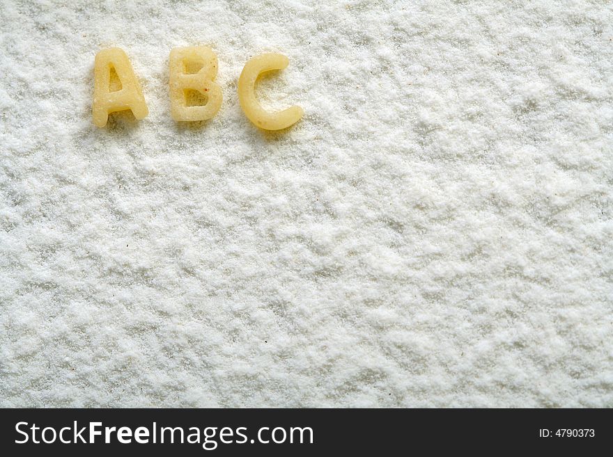 Eatable alphabet on flour, education, background