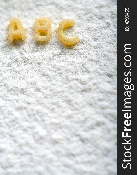 Eatable alphabet on flour, education, background