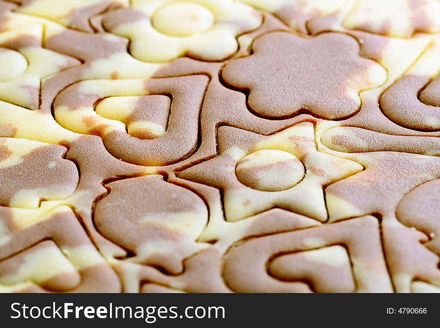 Various figures on a spotty dough, food background