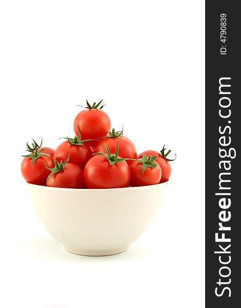 A bowl full of cherry tomatoes on white backgrund