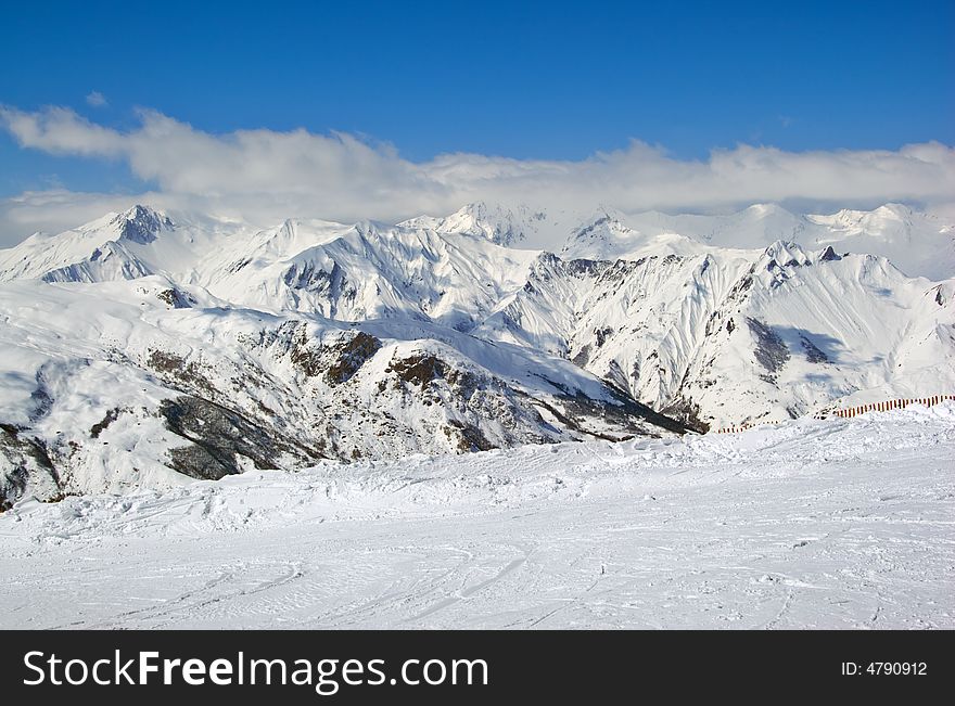 View over a snowy mountain valley. View over a snowy mountain valley