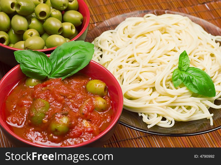 Dinner composition - macaroni,   olives, sauce