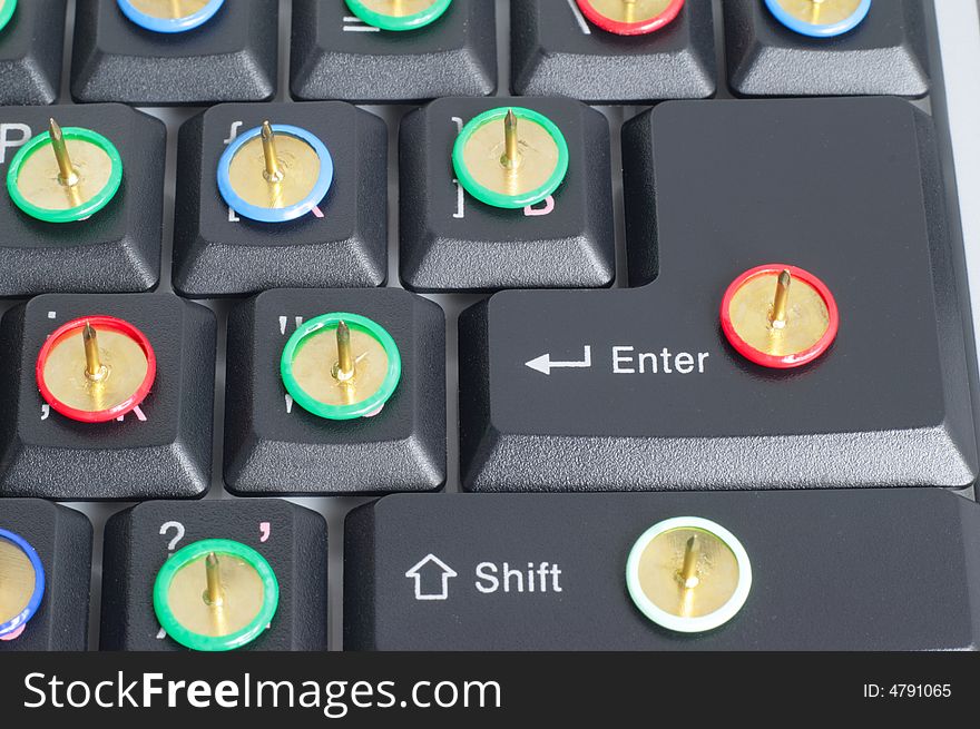 Computer keyboard with thumb tacks