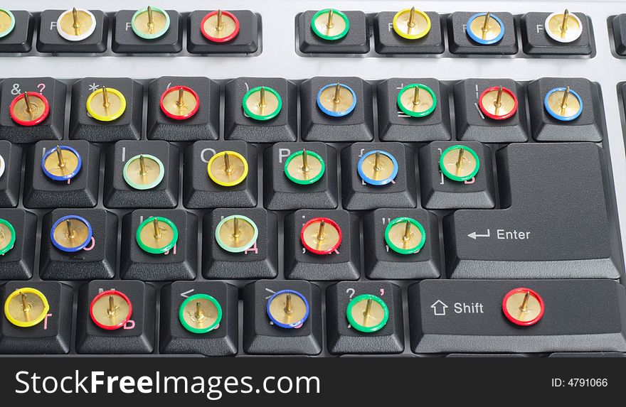 Computer keyboard with thumb tacks