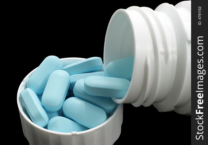 Blue tablets in white can