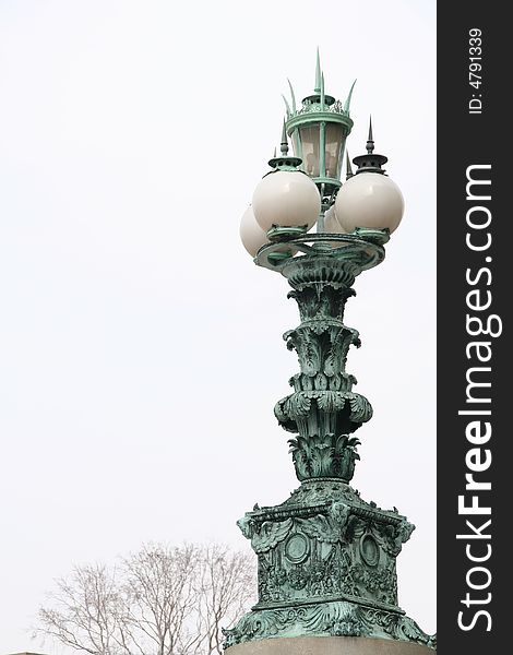 A streetlamp  in bronze outside of Library of Congress in Washington DC. A streetlamp  in bronze outside of Library of Congress in Washington DC