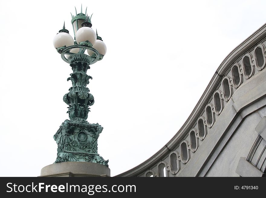 A streetlamp  in bronze outside of Library of Congress in Washington DC. A streetlamp  in bronze outside of Library of Congress in Washington DC