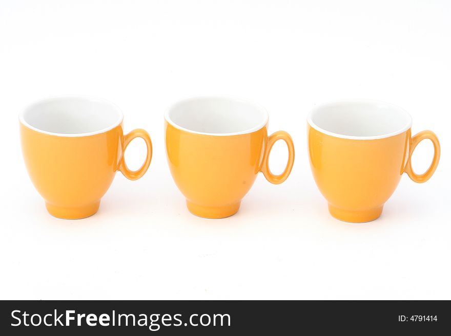 Mixture of orange CUPS on a white background