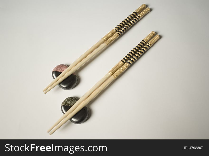 Double couple of japanese sticks with place card. Double couple of japanese sticks with place card