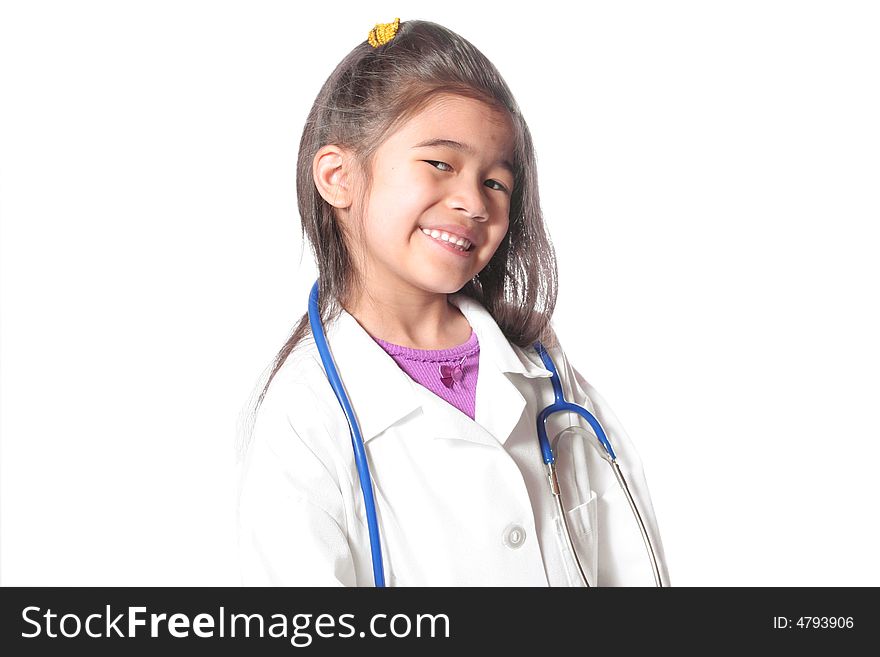 Adorable six year old in doctor's lab coat and stethoscope. part Asian, part Scandinavian descent. Adorable six year old in doctor's lab coat and stethoscope. part Asian, part Scandinavian descent.