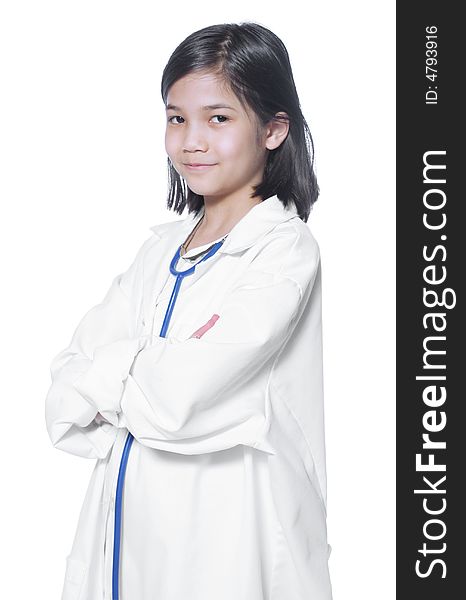 Nine year old girl playing doctor with white lab coat and stethoscope. Nine year old girl playing doctor with white lab coat and stethoscope