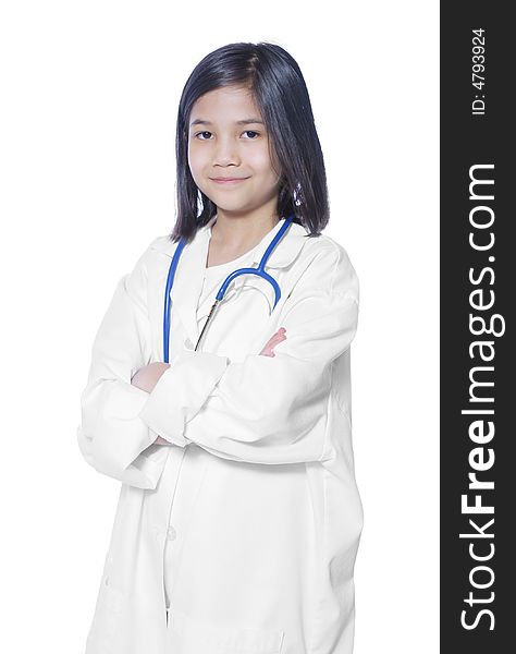 Nine year old girl playing doctor with white lab coat and stethoscope. Nine year old girl playing doctor with white lab coat and stethoscope