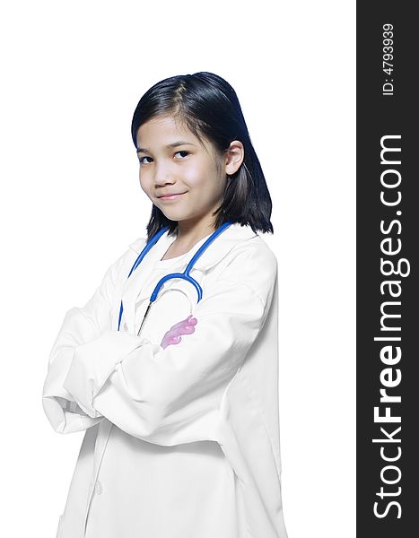 Nine year old girl playing doctor with white lab coat and stethoscope. Nine year old girl playing doctor with white lab coat and stethoscope