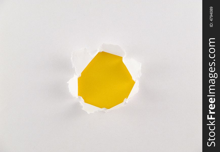 White paper with yellow hole.