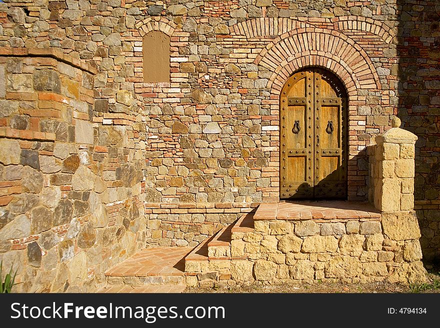 Shot of an oval doorway famed in stone and brick. Shot of an oval doorway famed in stone and brick.