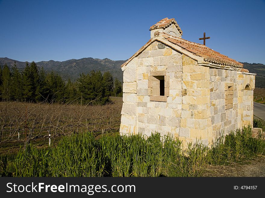 Shot of a small stone chapel located ina a vineyard.