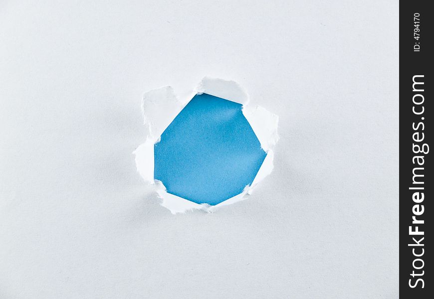 White paper with blue hole.