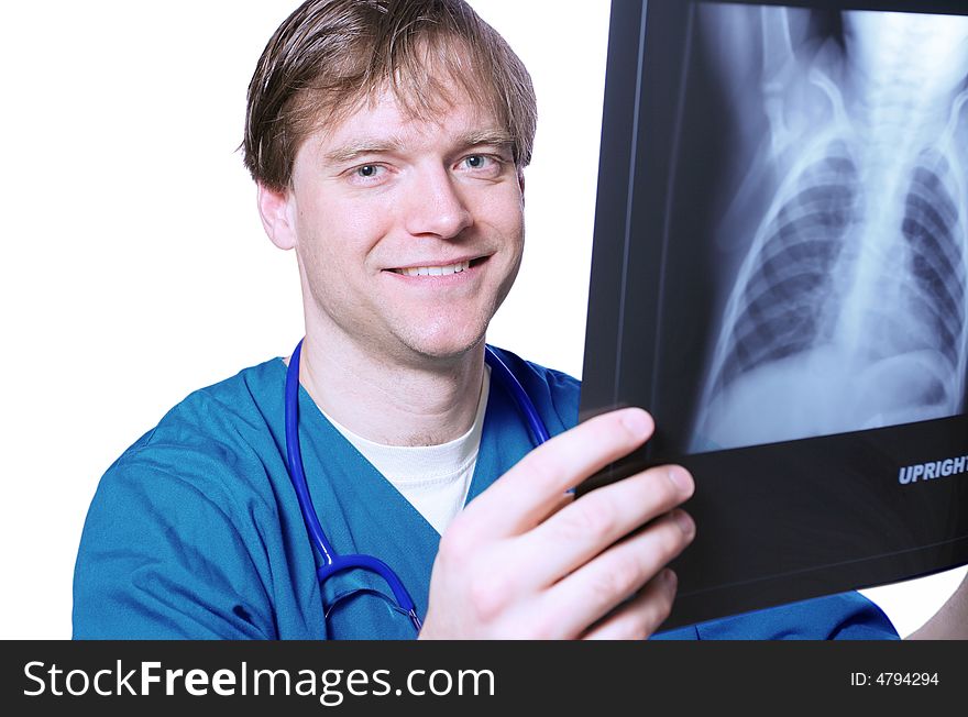 Handsome Male doctor looking at xray