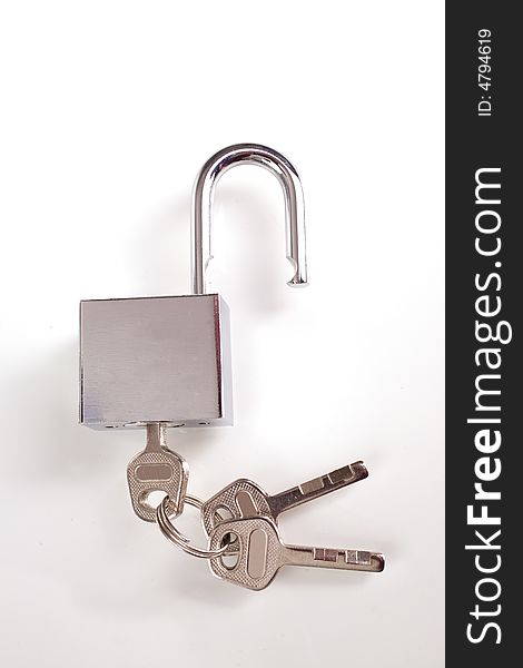 Metal padlock over white