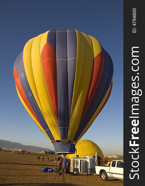 One of the many balloons at the Taos balloon festival being inflated at dawn