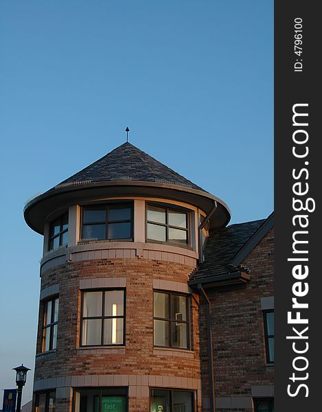 A cottage style tower made of red bricks