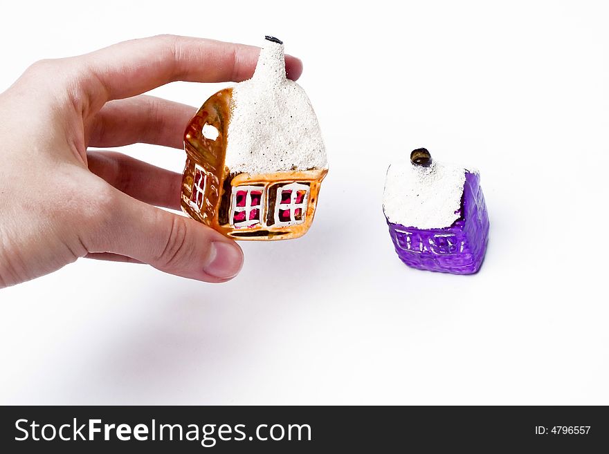 House in hand and another house against the white background