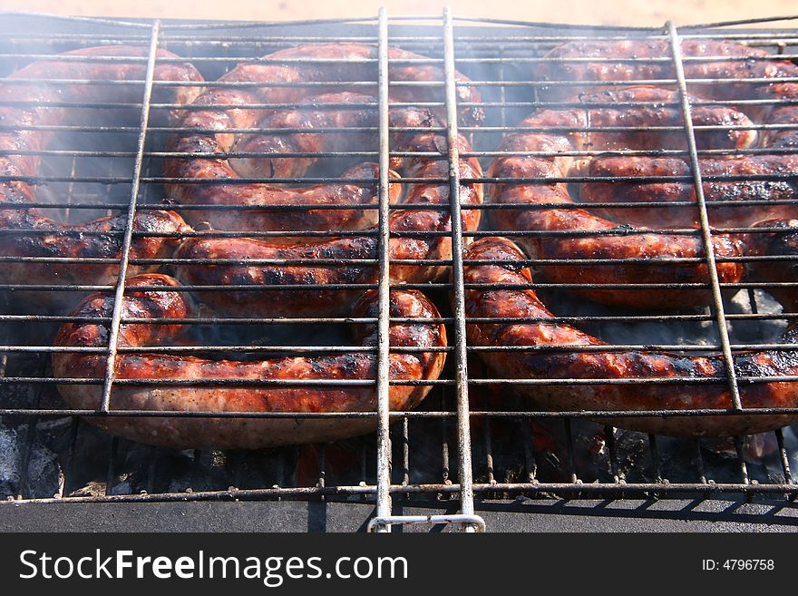 Outdoor barbecue sausage with smoke