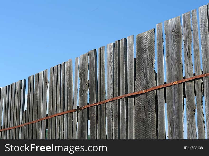 Old Wood Fence over a blue sky