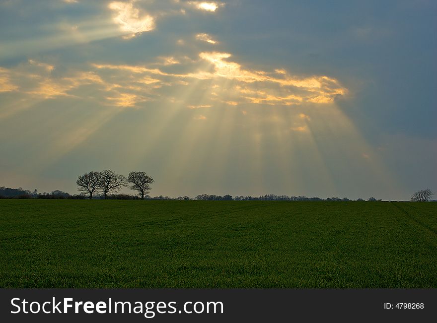 A fantastic sun burst lights a rural scene. A fantastic sun burst lights a rural scene