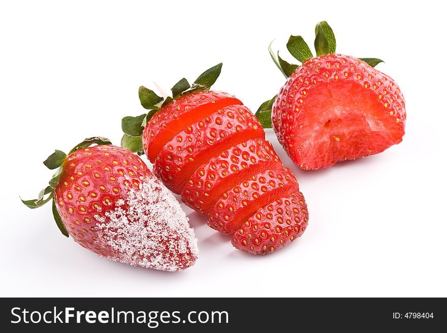 Three Strawberry - sliced, bitten and with sugar