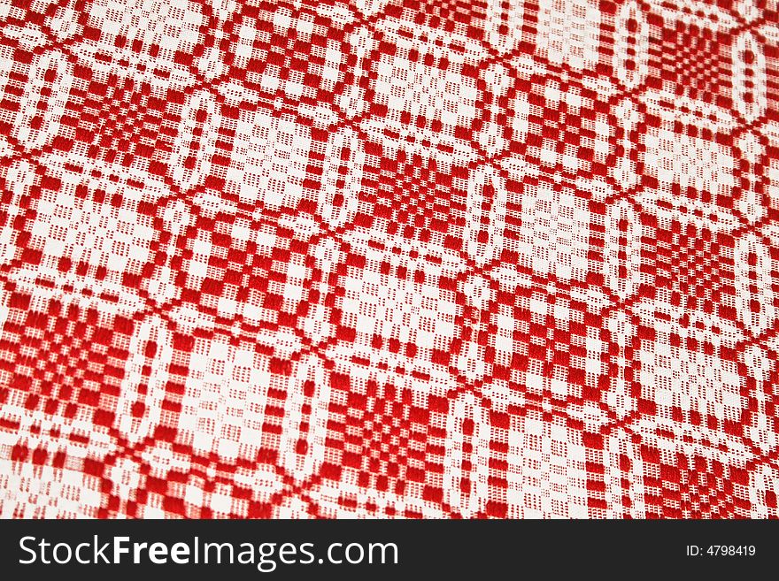 Patterned tablecloth in red and white colors. Patterned tablecloth in red and white colors