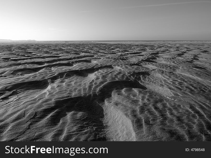 Patterns made in the sand along the beach. Patterns made in the sand along the beach