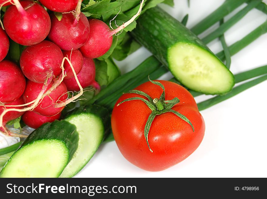 Radish, green onion, cucumber, tomato isolated on white. Radish, green onion, cucumber, tomato isolated on white