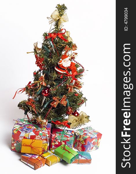 Christmas tree and presents isolated on white. Christmas tree and presents isolated on white