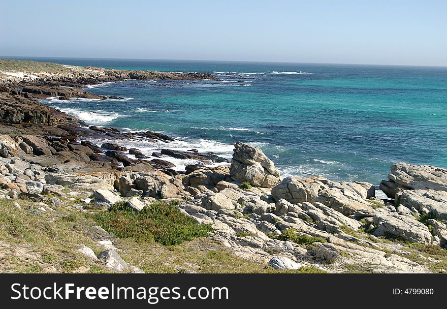 Rocky shores of Cape of Good Hope where Atlantic and Indian Oceans meet. South Africa.