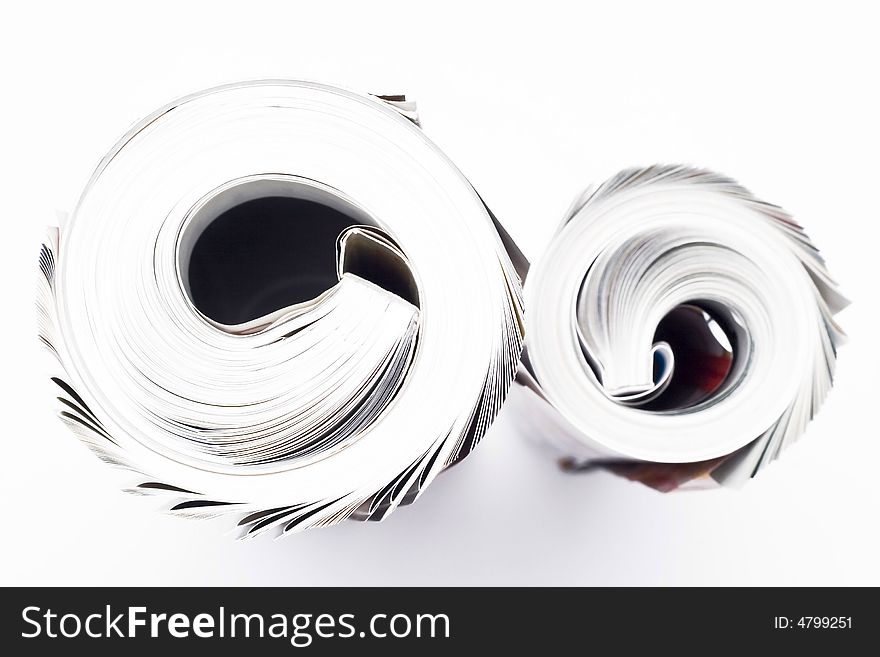 Rolled business magazines isolated on white. Rolled business magazines isolated on white