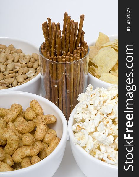 At parties and in television snacks may not be missing, chips peanuts popcorn salted sticks