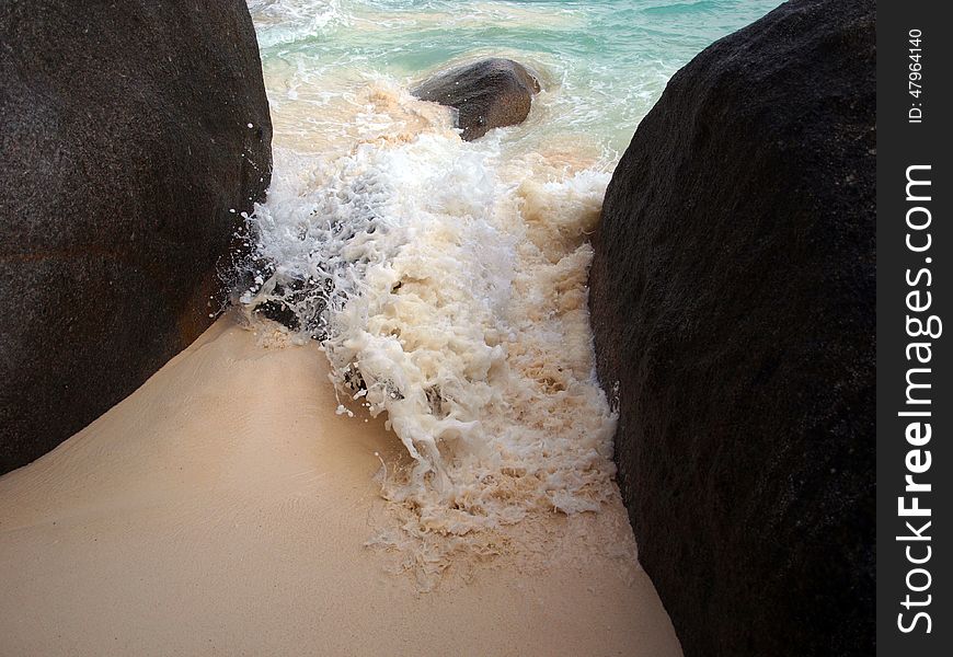 Sea wave between two big rocks. Sea wave between two big rocks