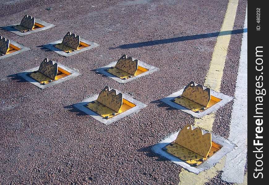 Traffic speed restrictors in the road