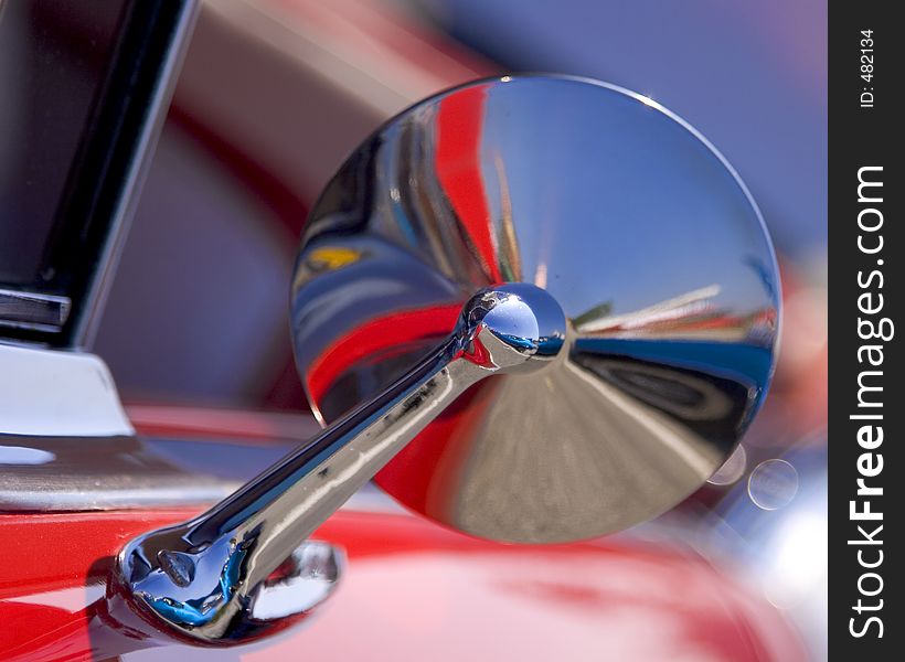 Close up of a mirror on a vintage car. Close up of a mirror on a vintage car