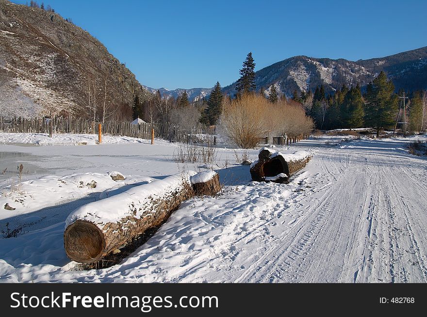 Winter road and logs