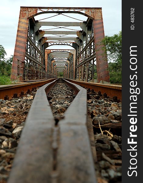 Old rusty train bridge. Old rusty train bridge