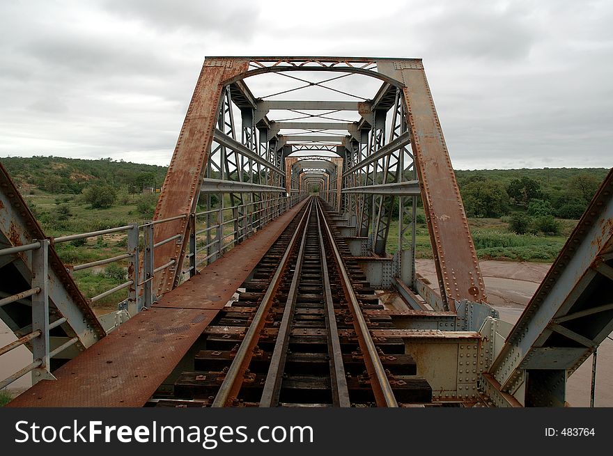 Old rusty train bridge. Old rusty train bridge