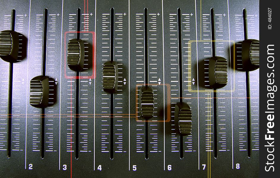 An image of a midi controller with faders with graphic shapes overlayed. An image of a midi controller with faders with graphic shapes overlayed