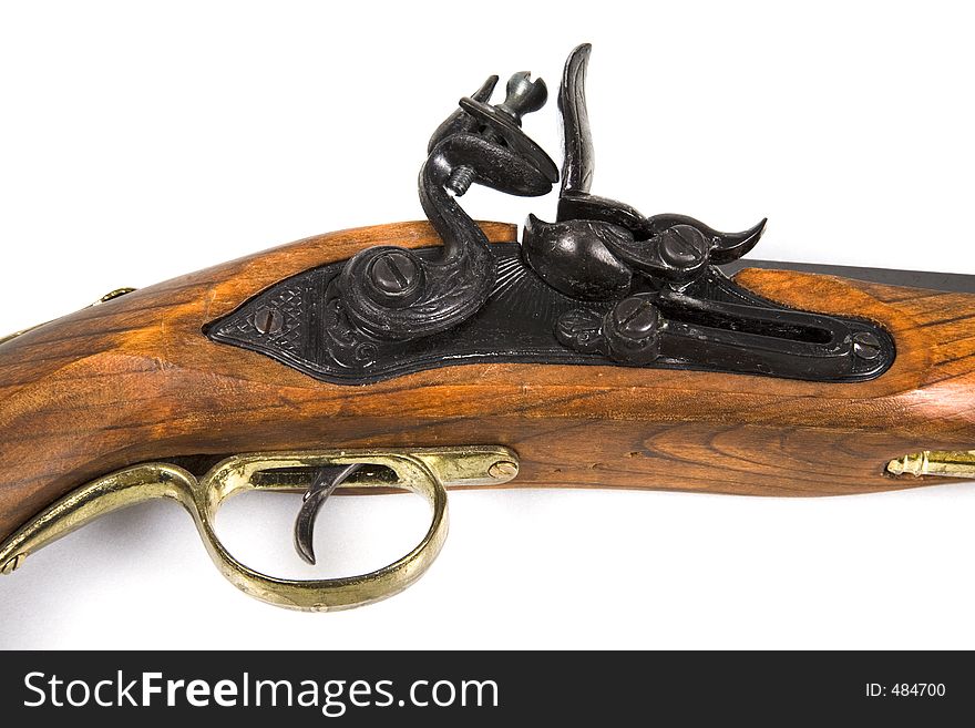 An antique pistol - trigger and flint view. An antique pistol - trigger and flint view